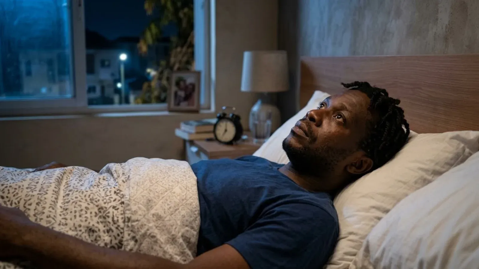 A veteran lying awake in bed at night